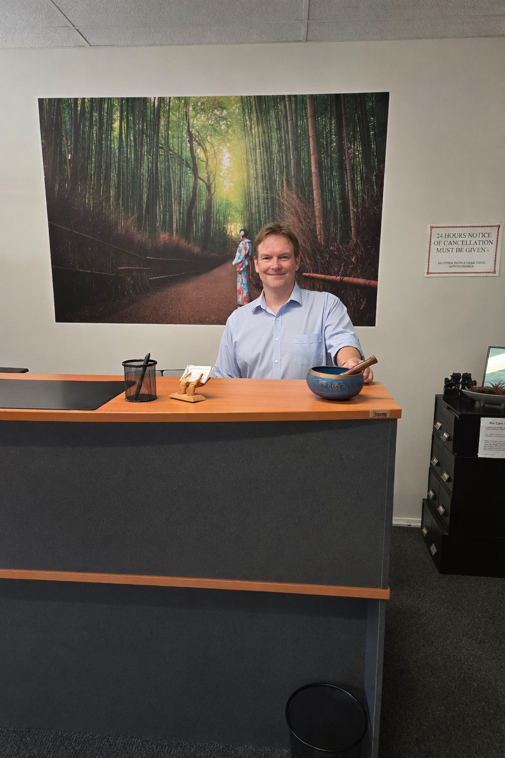 Dr David Chapman (Chiropractor) at reception desk — Centrepoint Chiropractic Clinic Caboolture South
